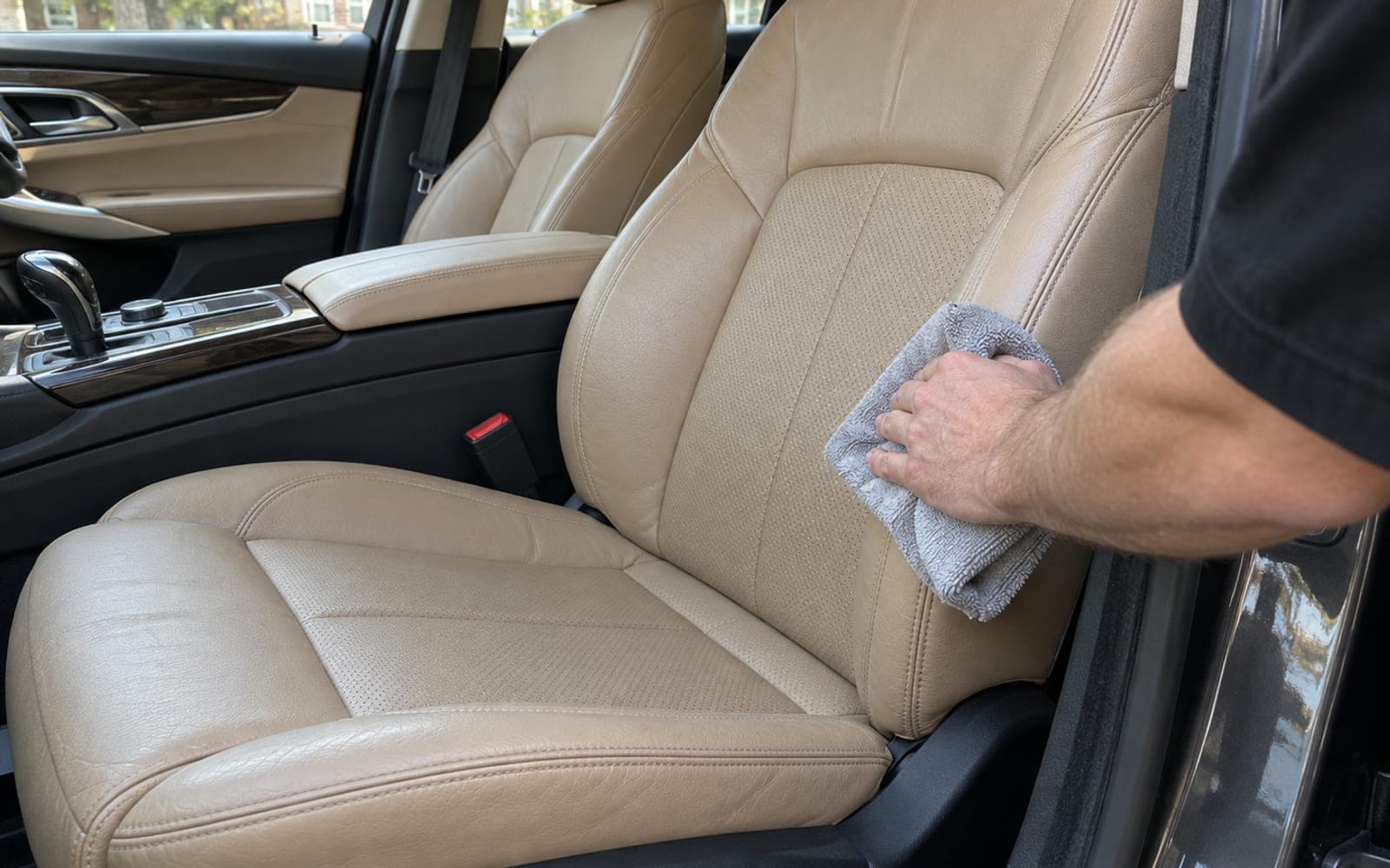 A tan leather seat wiped down with a microfiber towel