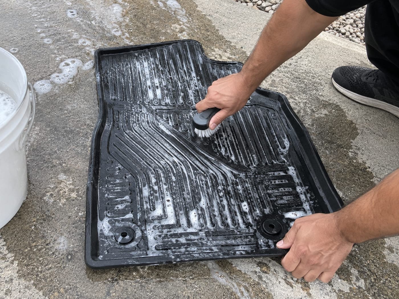 An illustration of clean vehicle floor mats laid out after cleaning